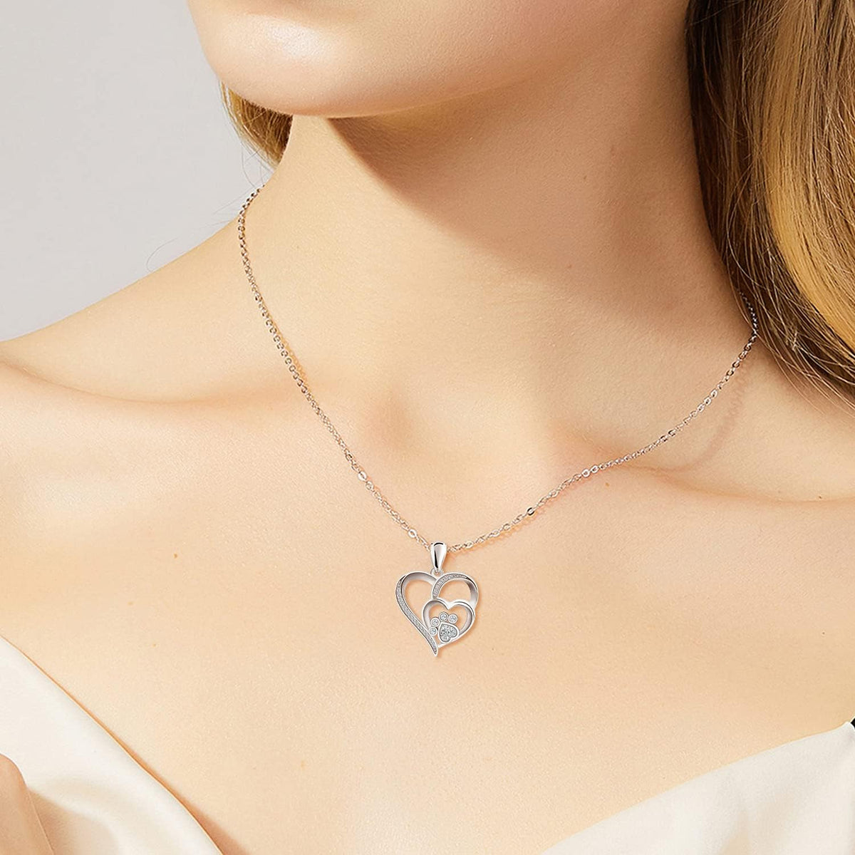 Sterling silver necklace with paw and heart with cubic zirconia
