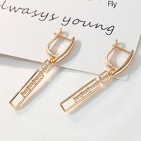 Elegant Rectangular Earrings with Purple Crystals in Gold
